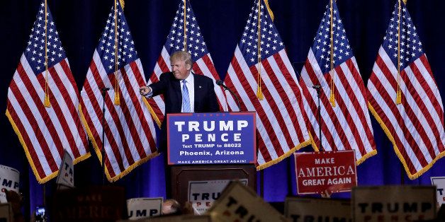 Republican presidential candidate Donald Trump points to the audience after delivering an immigration policy speech during a campaign rally at the Phoenix Convention Center, Wednesday, Aug. 31, 2016, in Phoenix. (AP Photo/Matt York)