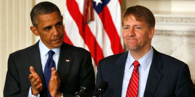 U.S. President Barack Obama (L) stands next to the new Director of the Consumer Financial Protection Bureau Richard Cordray in the State Dining Room at the White House in Washington July 17, 2013. The U.S. Senate on Tuesday confirmed Cordray as director of the Consumer Financial Protection Bureau, ending a nearly two-year standoff in Congress and putting the new agency on sounder legal footing. REUTERS/Larry Downing (UNITED STATES - Tags: POLITICS BUSINESS)