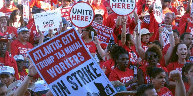 In this July 21, 2016 photo, striking union members rally outside the Trump Taj Mahal casino in Atlantic City, N.J. On Thursday Aug. 4, the strike by Local 54 of the Unite-HERE union will have lasted 35 days, making it the longest in the city's 38-year casino era. (AP Photo/Wayne Parry)