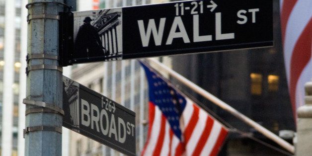 Wall Street sign with flags