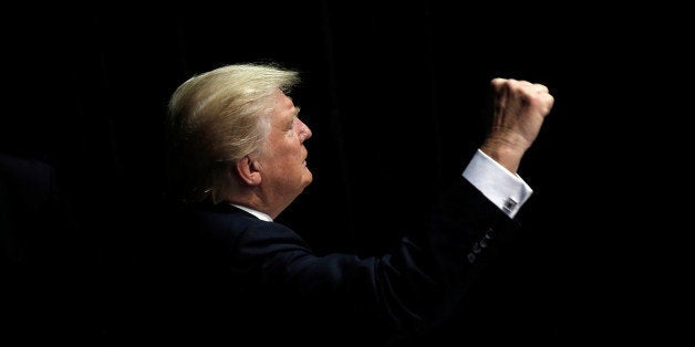 Republican presidential nominee Donald Trump gestures to supporters as he departs a campaign rally in Clive, Iowa, U.S., September 13, 2016. REUTERS/Mike Segar