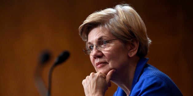 Sen. Elizabeth Warren, D-Mass., listens to Federal Reserve Chair Janet Yellen testify before the Senate Banking, Housing, Urb