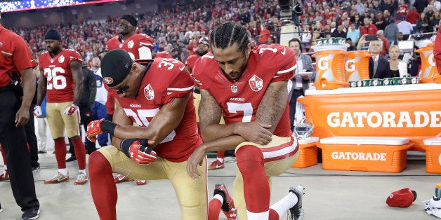 San Francisco 49ers safety Eric Reid (35) and quarterback Colin Kaepernick (7) kneel during the national anthem before an NFL football game against the Los Angeles Rams in Santa Clara, Calif., Monday, Sept. 12, 2016. (AP Photo/Marcio Jose Sanchez)