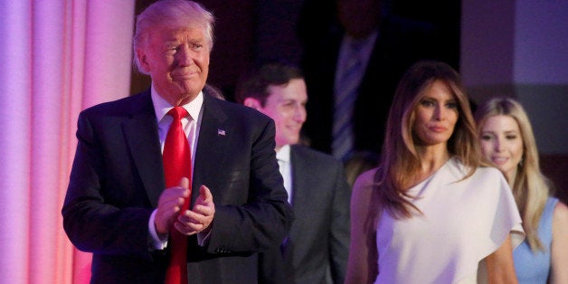 Republican U.S. president-elect Donald Trump stands wife Melania and family at his election night rally in Manhattan, New York, U.S., November 9, 2016. REUTERS/Carlo Allegri TPX IMAGES OF THE DAY 