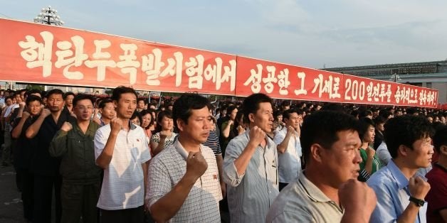 Participants gesture during a celebration rally attended by service members and civilians following the country's successful test of a nuclear warhead on September 9, in Kim Il Sung Square in Pyongyang on September 13, 2016. North Korea is ready to conduct another nuclear test at any time, South Korea's defence ministry said on September 12, just days after Pyongyang sparked worldwide condemnation with its fifth and most powerful test. / AFP / Kim Won-Jin (Photo credit should read KIM WON-JIN/AFP/Getty Images)