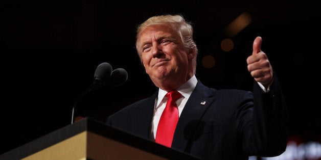 CLEVELAND, OH - JULY 21: Republican presidential candidate Donald Trump gives a thumbs to the crowd during his speech on the fourth day of the Republican National Convention on July 21, 2016 at the Quicken Loans Arena in Cleveland, Ohio. Republican presidential candidate Donald Trump received the number of votes needed to secure the party's nomination. An estimated 50,000 people are expected in Cleveland, including hundreds of protesters and members of the media. The four-day Republican National Convention kicked off on July 18. (Photo by Chip Somodevilla/Getty Images)