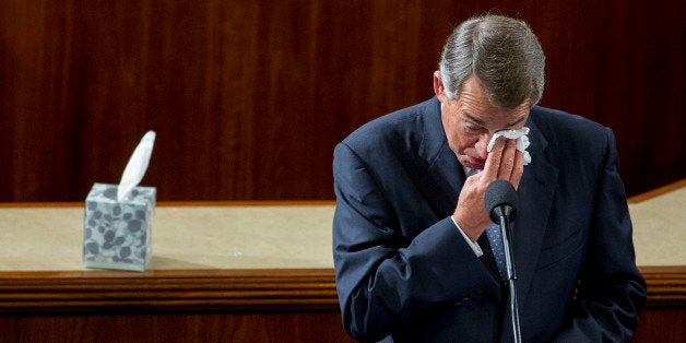 U.S. House Speaker John Boehner, a Republican from Ohio, wipes his eyes as he gives a farewell speech during a House Speaker