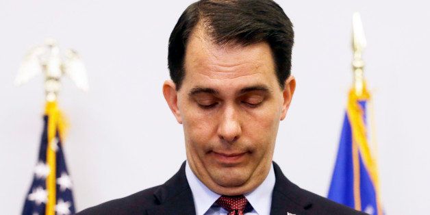 Wisconsin Gov. Scott Walker pauses as he speaks at a news conference Monday, Sept. 21, 2015, in Madison, Wis., where he announced that he is suspending his Republican presidential campaign. (AP Photo/Morry Gash)