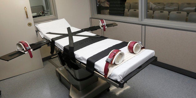 FILE - This Oct. 9, 2014, file photo shows the gurney in the the execution chamber at the Oklahoma State Penitentiary in McAlester, Okla. State question 776, a proposal to ask Oklahoma voters to enshrine the death penalty in the state's nearly 100-year-old constitution sailed easily through the Legislature, but now is facing opposition from groups on opposite ends of the political spectrum. (AP Photo/Sue Ogrocki, File)