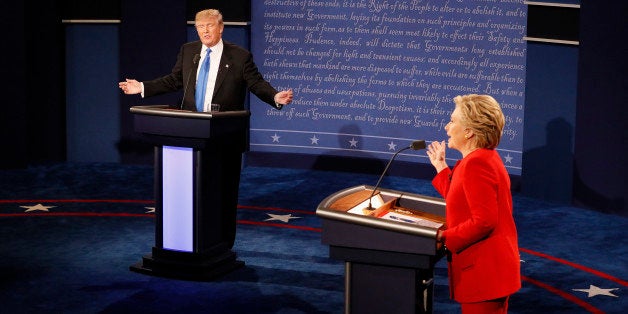 Republican U.S. presidential nominee Donald Trump and Democratic U.S. presidential nominee Hillary Clinton speak simultaneously during their first presidential debate at Hofstra University in Hempstead, New York, U.S., September 26, 2016. REUTERS/Rick Wilking