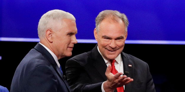 Republican vice-presidential nominee Gov. Mike Pence and Democratic vice-presidential nominee Sen. Tim Kaine walk off the stage after the vice-presidential debate at Longwood University in Farmville, Va., Tuesday, Oct. 4, 2016. (AP Photo/David Goldman)