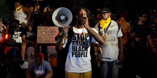 A Black Lives Matter protester addresses fellow protesters near the site of Democratic National Convention in Philadelphia, P