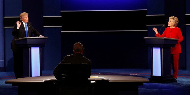 Republican U.S. presidential nominee Donald Trump and Democratic U.S. presidential nominee Hillary Clinton speak at their first presidential debate at Hofstra University in Hempstead, New York, U.S., September 26, 2016. Picture taken September 26, 2016. REUTERS/Mike Segar