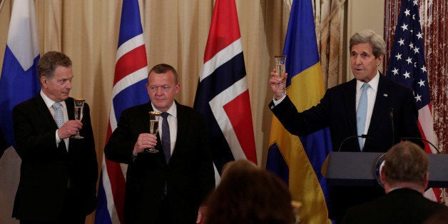 U.S. Secretary of State John Kerry (R) toasts next to Finnish President Sauli Niinisto (L) and Danish Prime Minister Lars Lokke Rasmussen at the working luncheon in honour of Nordic leaders at the Department of State in Washington, U.S. May 13, 2016. REUTERS/Yuri Gripas 