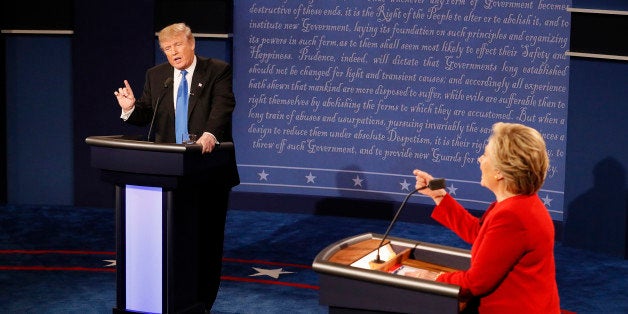 Republican U.S. presidential nominee Donald Trump and Democratic U.S. presidential nominee Hillary Clinton speak simultaneously during their first presidential debate at Hofstra University in Hempstead, New York, U.S., September 26, 2016. REUTERS/Rick Wilking