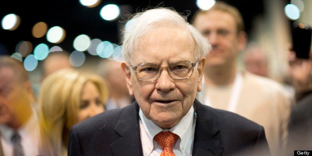 Warren Buffett, chairman and chief executive officer of Berkshire Hathaway Inc., tours the exhibition floor prior to the start of the Berkshire shareholders meeting in Omaha, Nebraska, U.S., on Saturday, May 4, 2013. Buffett's Berkshire Hathaway said first-quarter profit rose 51 percent on gains from equity-linked derivatives and insurance operations. Photographer: Daniel Acker/Bloomberg via Getty Images