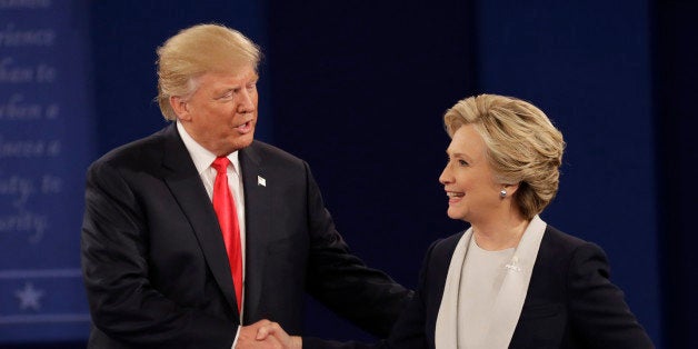 Republican presidential nominee Donald Trump shakes hands with Democratic presidential nominee Hillary Clinton following the second presidential debate at Washington University in St. Louis, Sunday, Oct. 9, 2016. (AP Photo/Patrick Semansky)