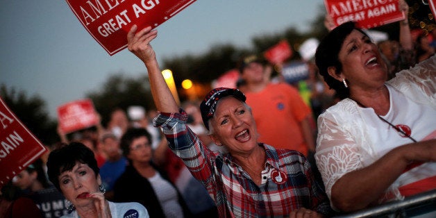 Supporters of Republican U.S. presidential nominee Donald Trump cheer at a campaign rally in Panama City, Florida, U.S., October 11, 2016. REUTERS/Mike Segar