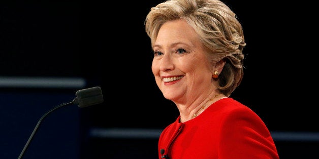 Democratic U.S. presidential nominee Hillary Clinton smiles during the first presidential debate with Republican U.S. preside