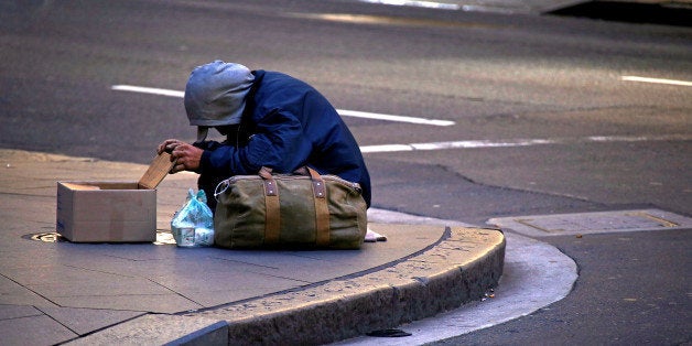 A man claiming to be homeless begs for money on a street corner in central Sydney, Australia July 2, 2016. Picture taken July 2, 2016. REUTERS/David Gray