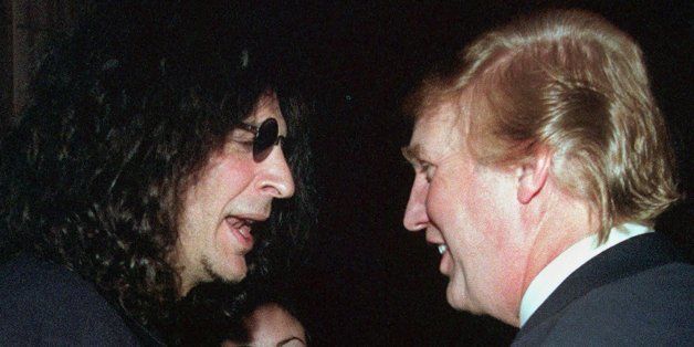 Broadcast personality Howard Stern, left, speaks with casino owner and possible presidential candidate Donald Trump at a party given by the New York Post, Wednesday, Feb. 9, 2000, in New York. (AP Photo/Louis Lanzano)
