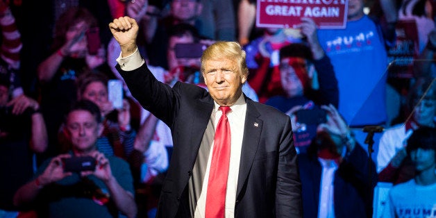 Republican presidential candidate Donald Trump waves to the crowd during a campaign rally, Thursday, Oct. 13, 2016, in Cincinnati. (AP Photo/John Minchillo)