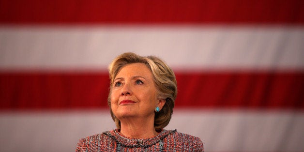 U.S. Democratic presidential nominee Hillary Clinton listens to former Vice President Al Gore talk about climate change at a