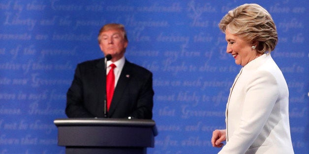 Democratic U.S. presidential nominee Hillary Clinton walks off the debate stage as Republican U.S. presidential nominee Donald Trump remains at his podium after the conclusion of their third and final 2016 presidential campaign debate at UNLV in Las Vegas, Nevada, U.S., October 19, 2016. REUTERS/Rick Wilking 