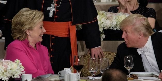 TOPSHOT - Democratic presidential nominee Hillary Clinton (L) and Republican presidential nominee Donald Trump shake hands after speaking during the Alfred E. Smith Memorial Foundation Dinner at Waldorf Astoria October 20, 2016 in New York, New York. / AFP / Brendan Smialowski (Photo credit should read BRENDAN SMIALOWSKI/AFP/Getty Images)