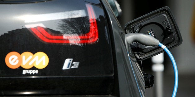 FILE PHOTO - A BMW i-3 electrical car is refueled at a power station for e-cars in the city centre of the western German city of Koblenz,IN, Germany in this March 1, 2016 file photo. REUTERS/Wolfgang Rattay/File Photo