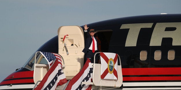 SANFORD, FL - OCTOBER 25: Republican presidential candidate Donald Trump waves as he prepares to board his plane after a cam