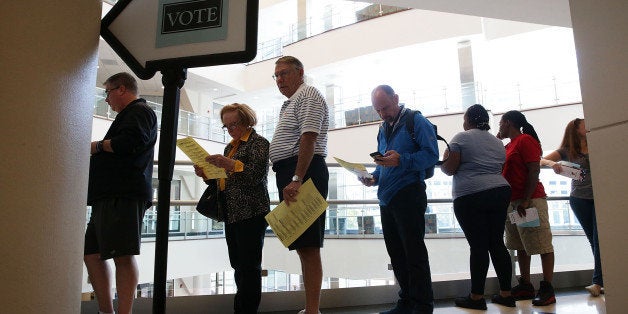 WINSTON-SALEM, NC - OCTOBER 28: Voters wait in line for casting their ballots during early voting for the 2016 general election at Forsyth County Government Center October 28, 2016 in Winston-Salem, North Carolina. Early voting has begun in North Carolina through November 5. (Photo by Alex Wong/Getty Images)