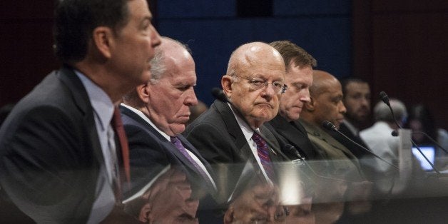 WASHINGTON, USA - SEPTEMBER 10: (Left to right.) FBI Director James Comey, CIA Director John Brennan, National Intelligence Director James Clapper, NSA Director Admiral Michael Roger, and DNI Director Lt. Gen. Vincent Stewart testify before a House Select Committee on Intelligence hearing on Cyber Security and the threat of Cyber Attacks in Washington, USA on September 10, 2015. (Photo by Samuel Corum/Anadolu Agency/Getty Images)