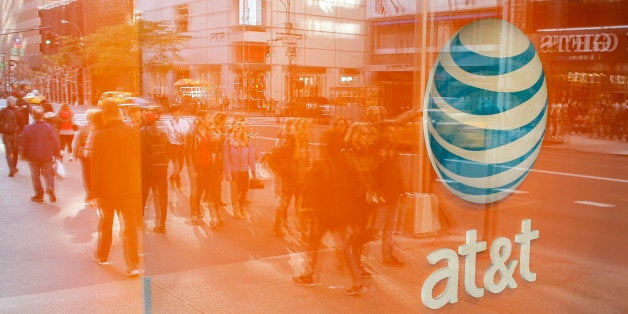 An AT&T store is seen on 5th Avenue in New York on October 23, 2016. AT&T unveiled a mega-deal for Time Warner that would transform the telecom giant into a media-entertainment powerhouse positioned for a sector facing major technology changes. The stock-and-cash deal is valued at $108.7 billion including debt, and gives a value of $84.5 billion to Time Warner -- a major name in the sector that includes the Warner Bros. studios in Hollywood and an array of TV assets such as HBO and CNN. / AFP / KENA BETANCUR (Photo credit should read KENA BETANCUR/AFP/Getty Images)