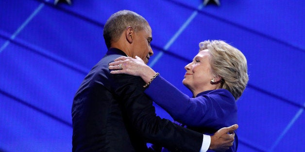 Democratic presidential nominee Hillary Clinton greets U.S. President Barack Obama as she arrives onstage at the end of his s