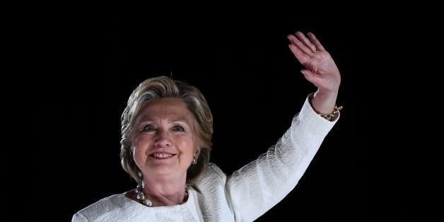 US Democratic presidential nominee Hillary Clinton waves to supporters during a campaign rally in Sanford, Florida, on November 1, 2016. With one week to go until election day, Hillary Clinton and Donald Trump were barnstorming battleground states, as the Democratic nominee tried to pivot away from attacks on her protection of US secrets. / AFP / JEWEL SAMAD (Photo credit should read JEWEL SAMAD/AFP/Getty Images)