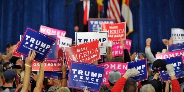 Supporters of Republican presidential nominee Donald Trump cheer during a campaign rally at the Bank of Colorado Arena on the campus of University of Northern Colorado in Greeley, Colorado on October 30, 2016.A key battleground state, Colorado could determine the outcome of the tightly contested presidential race between Trump and his opponent Democratic presidential nominee Hillary Clinton. / AFP / Jason Connolly (Photo credit should read JASON CONNOLLY/AFP/Getty Images)