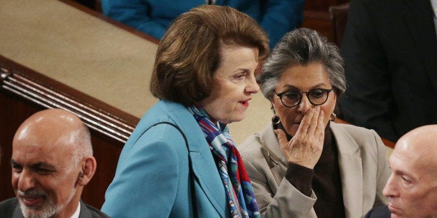 WASHINGTON, DC - MARCH 25: Sen. Dianne Feinstein (D-CA) (C) and Sen. Barbara Boxer (D-CA) talk after an adress to a joint meeting of Congress by Afghanistan President Ashraf Ghani (L) in the House Chamber at the U.S. Capitol March 25, 2015 in Washington, DC. Ghani and Afghanistan Chief Executive Officer Abdullah Abdullah have been in Washington all week for meetings with President Barack Obama, Secretary of State John Kerry, Defense Secretary Ash Carter and other administration officials. (Photo by Chip Somodevilla/Getty Images)