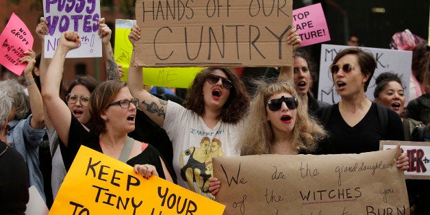 Women take part in a protest against Republican presidential candidate Donald Trump outside the Trump International Hotel and Tower in Chicago, Illinois, U.S. October 18, 2016. REUTERS/Joshua LottTEMPLATE OUT.