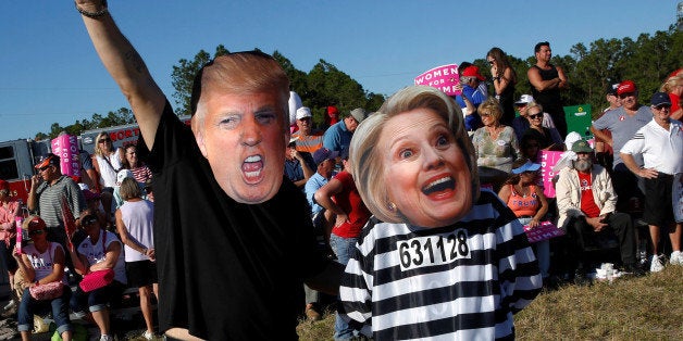 Craig Wendel dresses as Republican U.S. presidential nominee Donald Trump and his wife Jill Wendel wears a Hillary Clinton ma