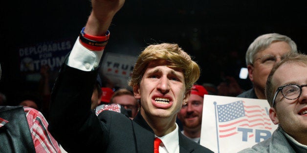 Supporters cheer during a campaign rally by Republican presidential nominee Donald Trump in Manchester, New Hampshire, U.S. November 7, 2016. REUTERS/Carlo Allegri