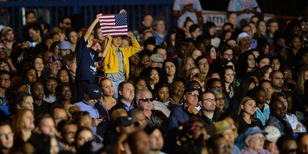 CHARLOTTE, UNITED STATES - NOVEMBER 04: Supporters are seen during a presidential election campaign rally, supporting Democrat Party's Presidential Candidate Hillary Clinton and staged with the participation of US President Barack Obama (not seen) at the PNC Music Pavilion in Charlotte, NC, USA on November 4, 2016 ahead of the US presidential election day which is 5 days away. President Barack Obama returns to North Carolina to campaign for Hillary Clinton. At a public meeting named 'Get Out The Early Vote' event in Charlotte; President Obama is urging North Carolinians to take advantage of one-stop early voting and lay out his support for Clinton and her vision of an America that is stronger together. (Photo by Peter Zay/Anadolu Agency/Getty Images)