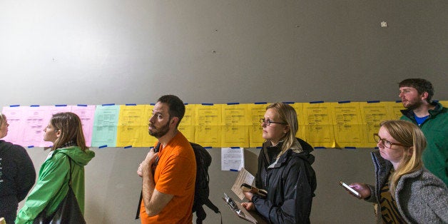 PORTLAND, ME - NOVEMBER 3: A long line of early voters stretches past sample ballots posted at City Hall. (Photo by Ben McCan