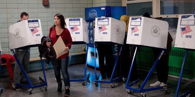 NEW YORK, NY - NOVEMBER 8: People vote at a polling site at Public School 261, November 8, 2016 in New York City. Citizens of