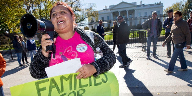 Ingrid Vaca, originally of Bolivia who now lives in Arlington, Va., rallies for immigration reform after marching from Arlington, Va. to the White House in Washington, Friday, Nov. 20, 2015, on the one-year anniversary of President Obama's announcement concerning Deferred Action for ChildhoodÂ Arrivals (DAPA). (AP Photo/Jacquelyn Martin)