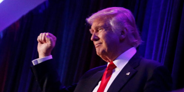 Republican U.S. presidential nominee Donald Trump gestures as he arrives to address supporters at his election night rally in Manhattan, New York, U.S., November 9, 2016. REUTERS/Jonathan Ernst