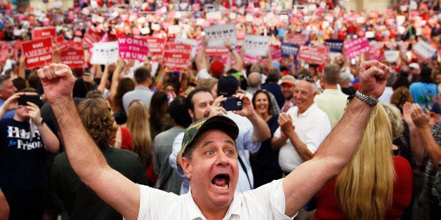 A supporter of Republican presidential nominee Donald Trump yells at the media during a campaign event in Concord, North Caro