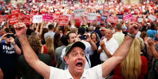 A supporter of Republican presidential nominee Donald Trump yells at the media during a campaign event in Concord, North Carolina, U.S. November 3, 2016. REUTERS/Carlo Allegri