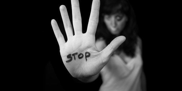 Stop violence against women. Hand saying stop