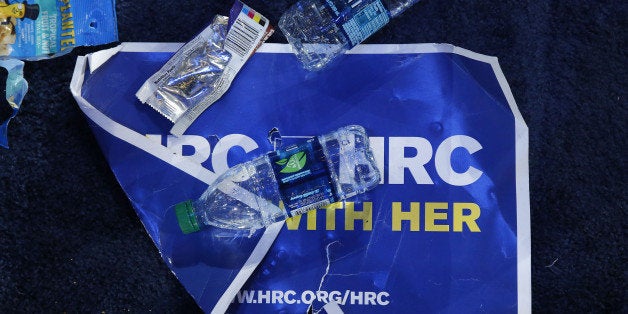 A campaign sign sits covered in trash after an election night party for 2016 Democratic Presidential Candidate Hillary Clinto
